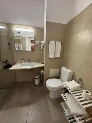 a glass shower in a bathroom with a sink at Monte Verde in Funchal