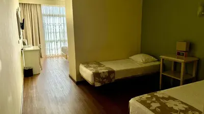 two beds in a small room withermottermottermott at Monte Verde in Funchal