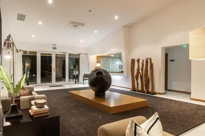 a living room with a vase on a table at Vila Valverde Design Country Hotel in Luz