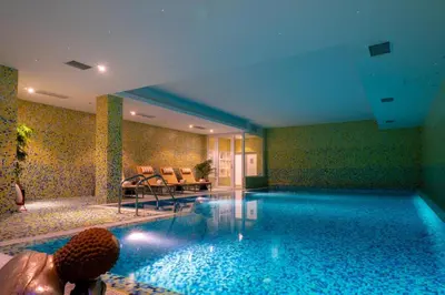 a hotel room with a swimming pool in a room at Vila Valverde Design Country Hotel in Luz