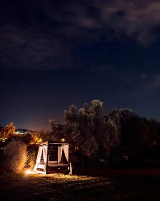 a small tent in a field at night at Vila Valverde Design Country Hotel in Luz