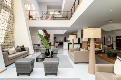 a living room with white furniture and a staircase at Vila Valverde Design Country Hotel in Luz