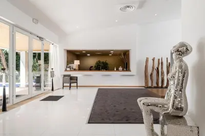 a living room with a chair and a rug at Vila Valverde Design Country Hotel in Luz