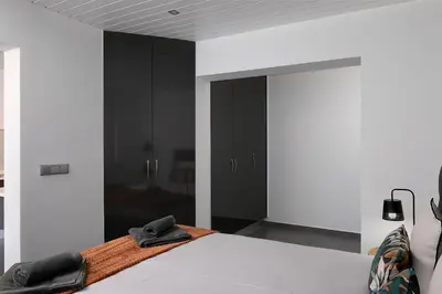 a bedroom with a bed with a hat on it at ANGEL´S SUNSET in Estreito da Calheta