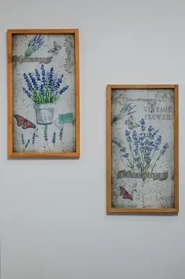 two framed pictures of flowers on a wall at ANGEL´S SUNSET in Estreito da Calheta