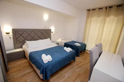 a hotel room with two beds with towels on them at Belo Horizonte in Luz