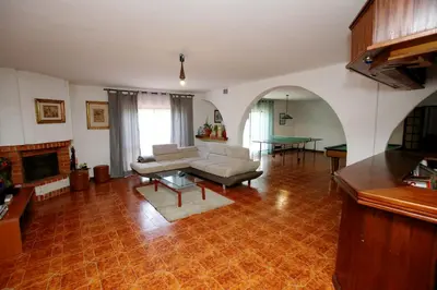 a living room with a couch and a table at Belo Horizonte in Luz