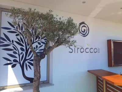 a tree mural on the wall of a office at Madeira Regency Cliff - Adults Only in Funchal