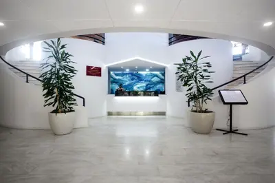 a sign for a hotel in front of a wall at Estalagem do Mar in São Vicente