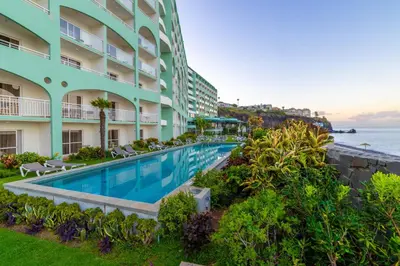 an image of the swimming pool at the ocean front hotel at Pestana Ocean Bay Resort in Funchal