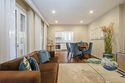 a living room with a couch and a table at Quinta da Tia Briosa by Homie in Ponta do Sol