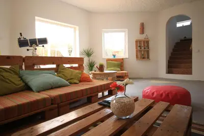 a living room with a couch and a table at Blacksheep Sagres Guesthouse & Surf in Sagres