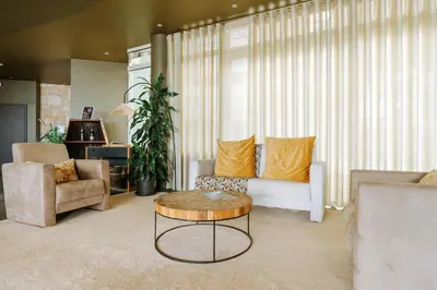 a living room with a couch and a coffee table at Hotel Euro Moniz in Porto Moniz