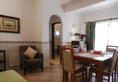 a dining room with a table and chairs at Residencia Julio in Sagres