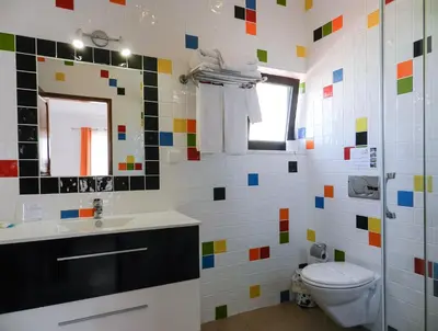 a bathroom with a toilet and a sink at Residencia Julio in Sagres