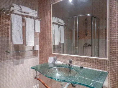a bathroom with a sink and a mirror at Residencia Julio in Sagres