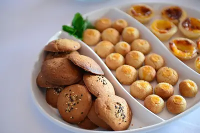 a plate of cookies and other food on a table at Pousada de Sagres in Sagres