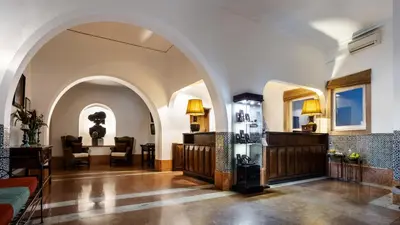 a living room with an archway in a building at Pousada de Sagres in Sagres