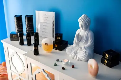 a white statue sitting on a shelf with some items at Pousada de Sagres in Sagres