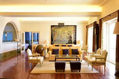 a living room with a couch and chairs at Pousada de Sagres in Sagres