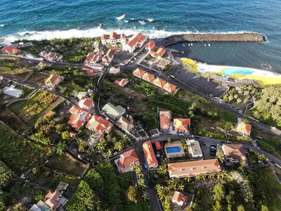 an aerial view of a town next to the ocean at Casa da Capelinha in Ponta Delgada