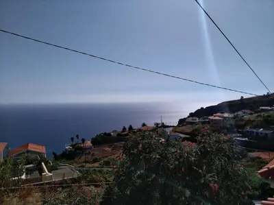 a view of the ocean from a hill at Canto da Manu Panoramic in Calheta