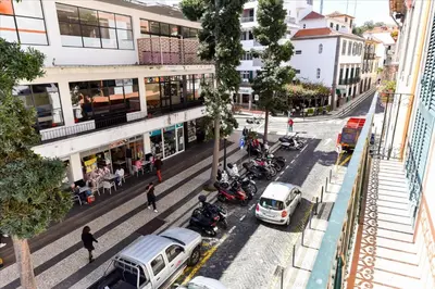 an overhead view of a city street with cars and motorcycles at Residencial Colombo in Funchal