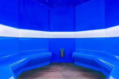 a row of blue benches in a bathroom at Calheta Beach - All-inclusive - Savoy Signature in Calheta