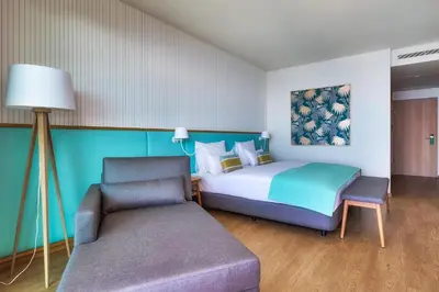 a white bathroom with a sink and a shower at Sentido Galomar - Adults Only in Caniço