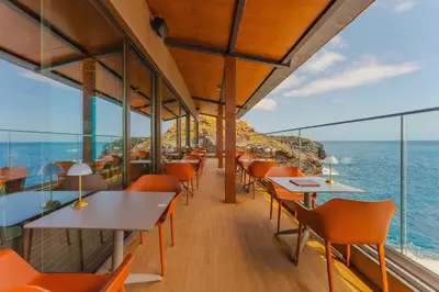a balcony with a table and chairs in a house at Sentido Galomar - Adults Only in Caniço
