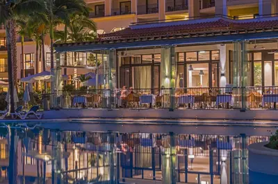 a hotel with a pool in front of a building at Suite Hotel Eden Mar - PortoBay in Funchal