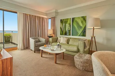 a living room with a couch and a table at The Cliff Bay - PortoBay in Funchal