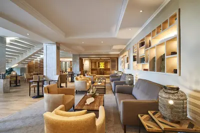 a table with a bowl of food and two glasses of wine at Hotel Porto Mare - PortoBay in Funchal
