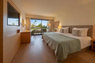 an aerial view of a resort with a swimming pool at Hotel Porto Mare - PortoBay in Funchal