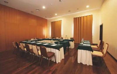 a conference room with long tables and chairs at Vila Gale Santa Cruz in Santa Cruz