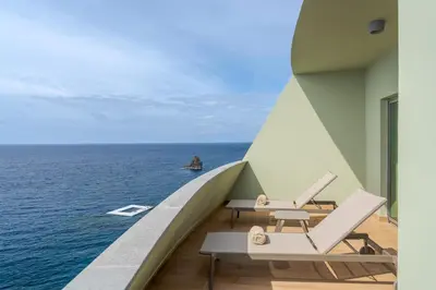 a view of the ocean from the balcony of a building at Pestana Vila Lido Madeira Ocean Hotel in Funchal