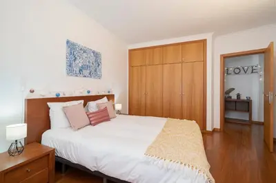 a room with two beds and a mirror at Apartamento Lobo Marinho by An Island Apart in Santa Cruz