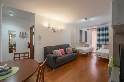 a living room with a couch and a table at Apartamento Lobo Marinho by An Island Apart in Santa Cruz