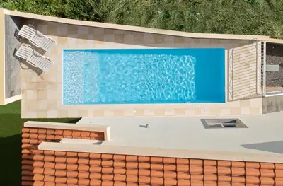 an overhead view of a swimming pool on a house at Arco da Calheta Villa in Arco da Calheta