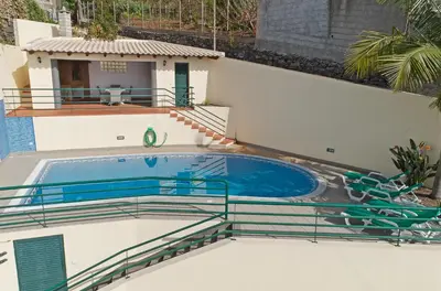 a swimming pool on the roof of a house at Charming Villa in Funchal in Funchal