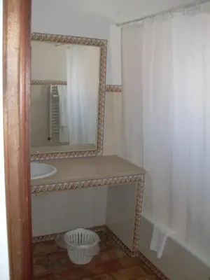 a bathroom with a mirror and a sink at Belver Porto Dona Maria Resort in Luz