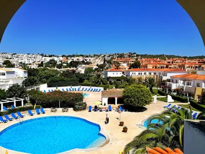 a view of a swimming pool and a resort at Luz Bay Hotel in Luz