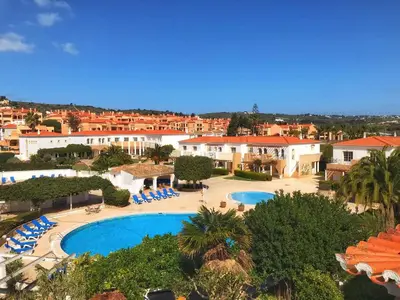 an aerial view of a resort with a swimming pool at Luz Bay Hotel in Luz