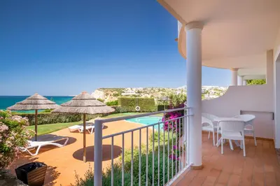 a balcony with a view of the ocean at Clube Porto Mos - Sunplace Hotels & Beach Resort in Lagos