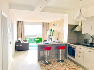 a bathroom with a tub and a sink and a toilet at Modern apartment in Funchal with sea view 70 m² in Funchal