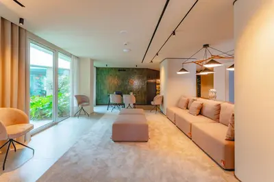 a living room with a couch and a table at Duas Torres Hotel in Funchal