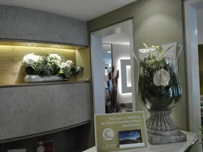 a room with a vase of flowers on a counter at Hotel Windsor in Funchal