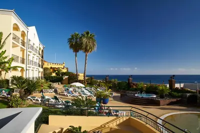 a view of a resort with the ocean in the background at PortoBay Santa Maria - Adults Only in Funchal