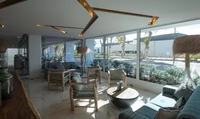 a living room with a lot of windows at Hotel Alto Lido in Funchal