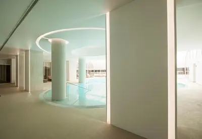 a hallway of a building with a glass floor at Hotel Alto Lido in Funchal